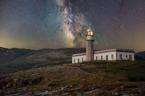 A lighthouse at the night with a beautiful background of a starry sky, Carnota, Galicia, Spain
