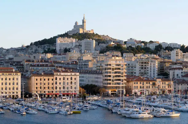 The view of Vieux-Port with Basilique Notre Dame de la Garde on the hill, Marseille, France.