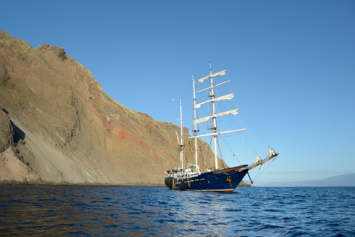The beautiful ship in the blue sea. Punta Vicente Roca, Isabela Island, Galapagos Islands, Ecuador.