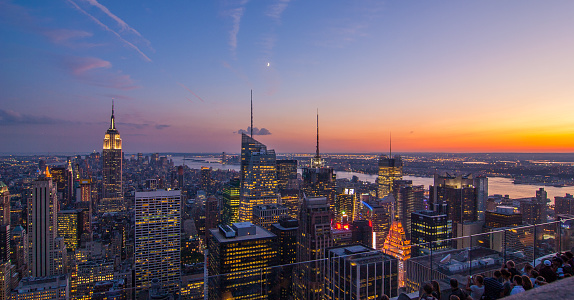 An aerial view of the Empire State Building in NYC in the evening