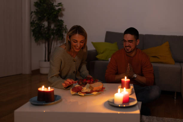 istock A man and woman are having dinner during blackout time during an energetic crisis. 1455454607