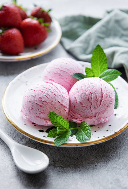 istock Homemade strawberry  ice cream with fresh strawberries 1455458585