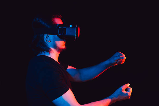 istock a man in virtual reality glasses is in a simulation 1455458652