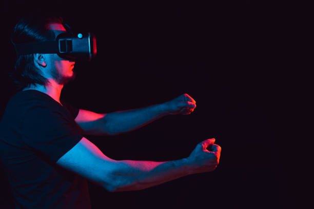 istock a man in virtual reality glasses is in a simulation 1455458673