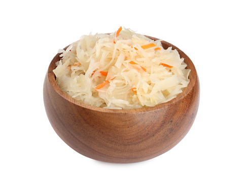 Bowl of tasty sauerkraut with carrot on white background