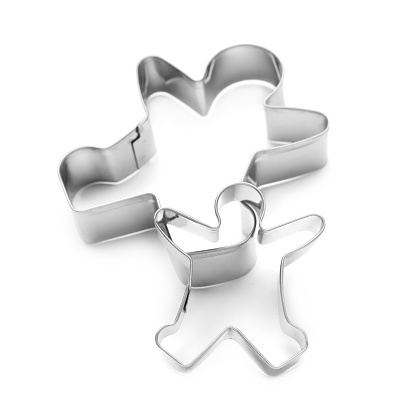 Gingerbread man cookie cutters on white background