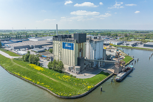 For farmers animal feed production and distribution warehouse at the Voorst industrial area in Zwolle seen from above.