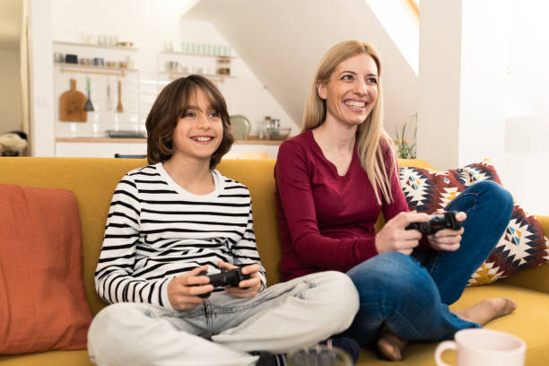 istock Boy and his mom gaming and having 1455463587