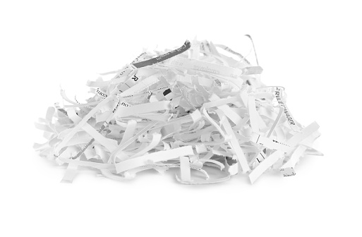 Many shredded paper strips on white background