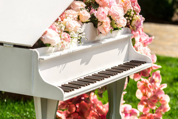 istock White outdoor piano with flowers 1455466046