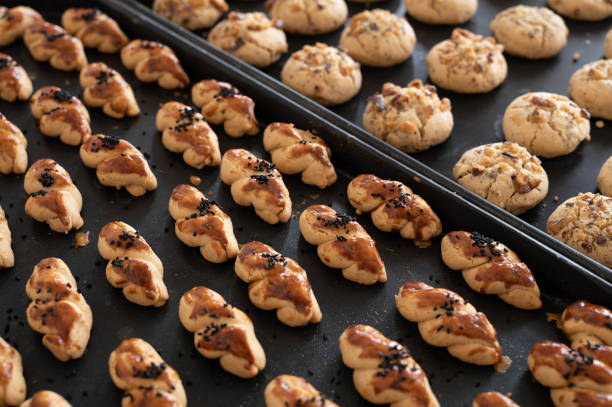 istock Traditional Turkish salty and sweet cookies lined up on baking sheets 1455467483