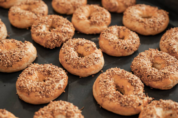 istock Circle salty cookies with sesame lined up on baking tray 1455467605