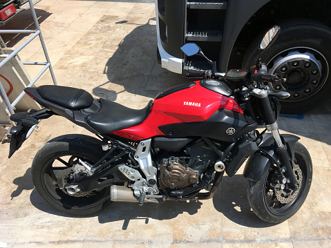 Antalya, Turkey 20.08.2022:Red motorcycle yamaha on the road close up