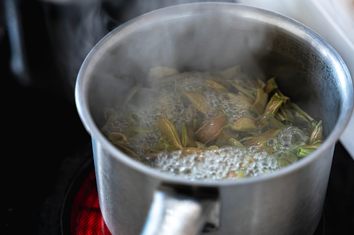 Fresh Green beans boiled in cooking pot on electric stove