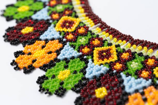 istock handmade colorful bead necklace close-up isolated on white background. 1455470384