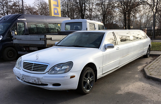Belarus, Minsk -04.01.2023:White  Mercedes-Benz S600 limousine parked in a parking lot in the city.Mercedes – Premier Edition.