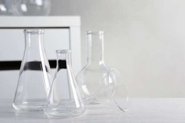 istock Set of laboratory glassware on white table indoors, space for text 1455470426
