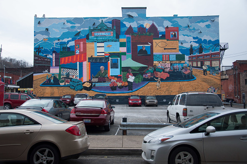 Pittsburgh, United States – December 01, 2013: A view of a parking lot against a colorful mural in the District Pittsburgh, PA, USA
