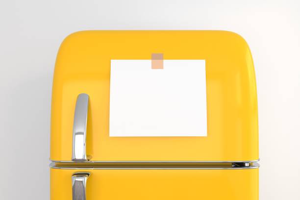 istock blank memo note sticker on yellow refrigerator close up. blank paper reminder on retro fridge door close up mockup 1455473370