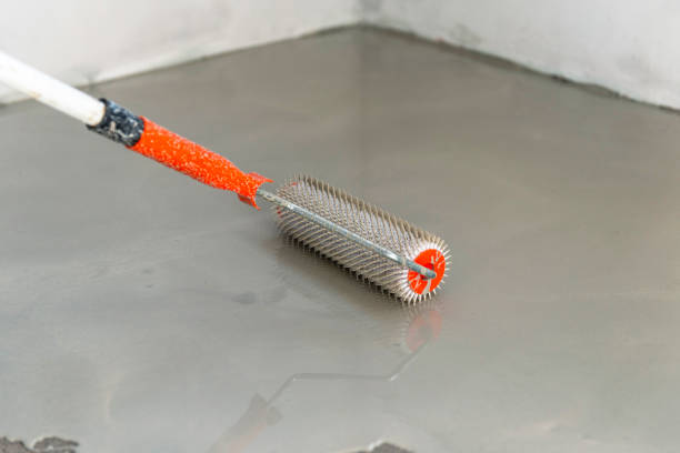 istock Self-leveling epoxy. Leveling with a mixture of cement floors. 1455476538