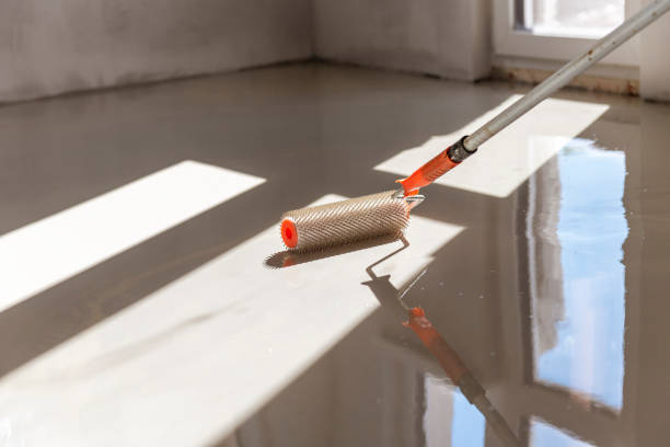 istock Self-leveling epoxy. Leveling with a mixture of cement floors. 1455476727