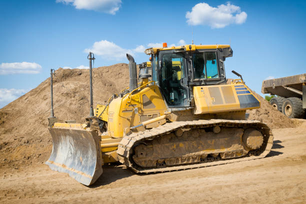 Yellow excavator on new construction site. Close up .Front view.