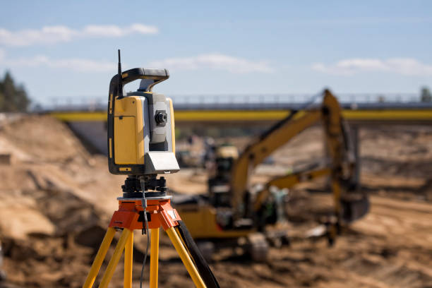istock Landsurveyor equipment on a highway construction site 1455477480
