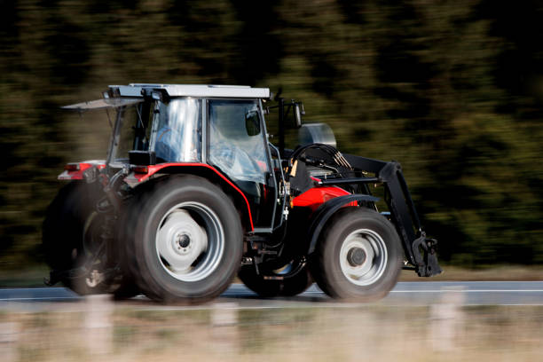 istock a modern tractor speeding in the countryside 1455477714