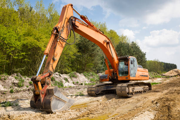 istock Excavator at the construction site of a new highway 1455479018
