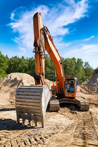 Excavator at the construction site of a new highway S3, Wolin, Poland