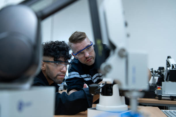 istock The robotic hand technology teacher is instructing new pupils on how to construct robotic hands for a variety of industrial applications. 1455479932