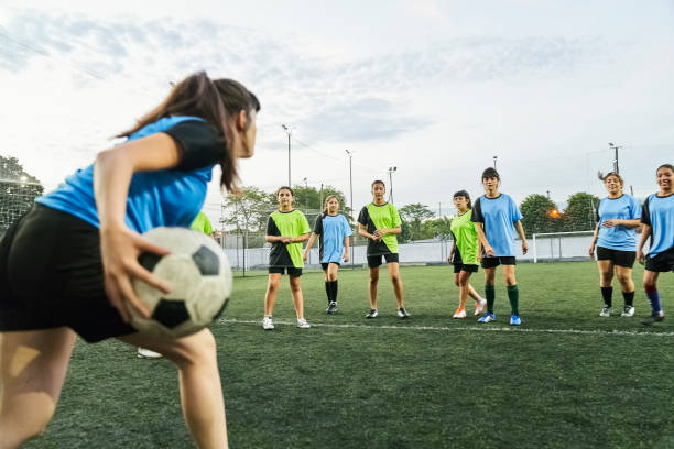 istock Girls teams having a soccer match 1455480726
