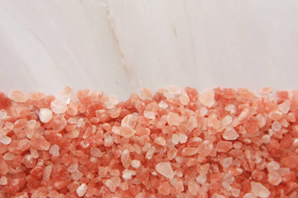 istock small granules of natural Himalayan salt on a gray marble background 1455484084