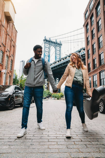 istock A multi-ethnic couple is dancing in Brooklyn with Manhattan Bridge in the background 1455484095