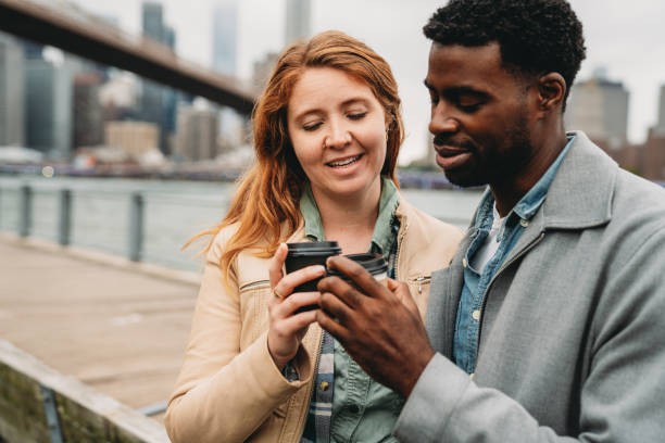 istock A multi-ethnic couple is drinking coffee in the city 1455484624