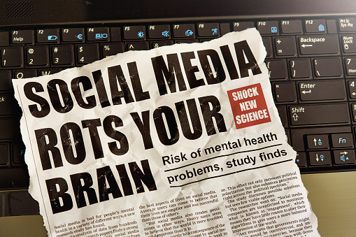 Simulated newspaper clipping about a scientific study finding that social media is bad for mental health, causing depression, anxiety and feelings of social inadequacy. Text was written from scratch by the photographer (an experienced journalist), who also did the design, so this image is free of third-party copyright and may be used without restrictions. Although the text was written with plausibility in mind, no claim of truth or accuracy is made about it.