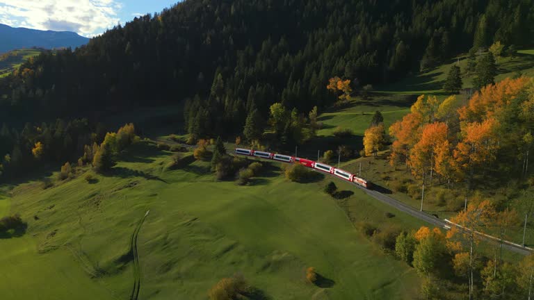 Aerial view of red train on bernina pass in autumn Switzerland