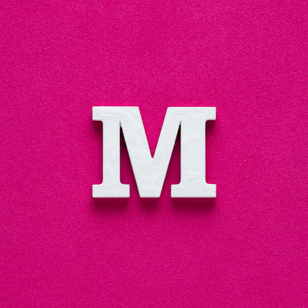 istock Letter M uppercase - White wood font on rhodamine red background 1455487635