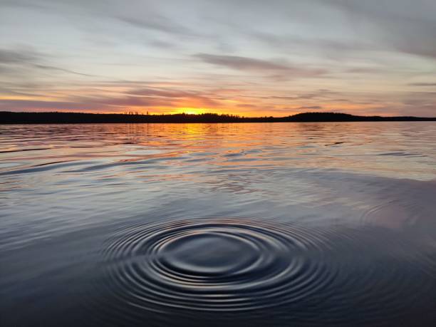 istock Ripple in the water with a sunset in the background 1455491458
