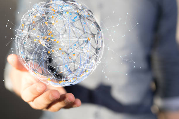 istock Shallow focus of human hands holding an interconnected globe icon, global interconnections concept 1455494700