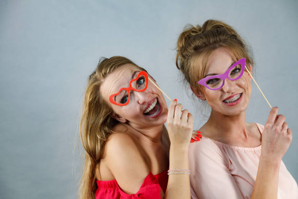 istock Two women with carnival masks 1455495885