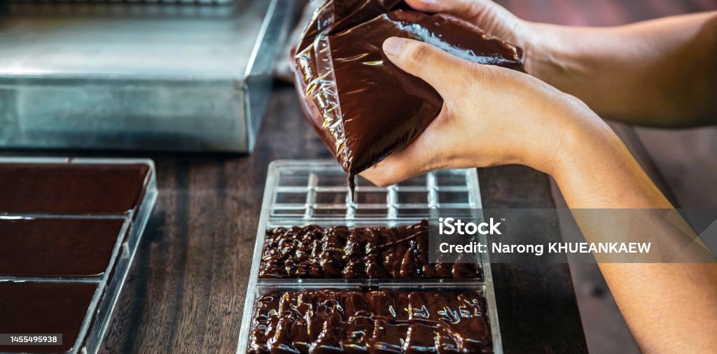 Close up of hand chef making homemade chocolate bars Baked Pastry Item Stock Photo