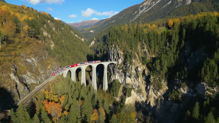 Aerial view of train Landwasser viaduct on bernina pass in Switzerland