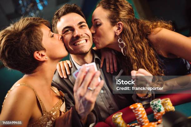 Happiness Friends Winning At The Casino Playing Poker Stock Photo - Download Image Now