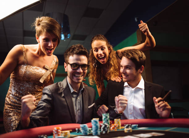 happiness friends winning at the casino playing poker stock photo