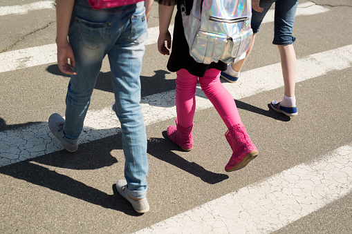 Schoolchildren crossing the road on their way to school