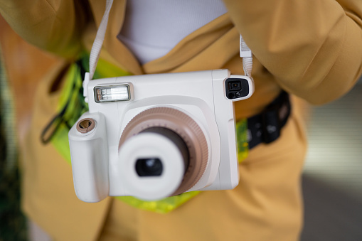 a modern fashionable film camera that takes instant photos
