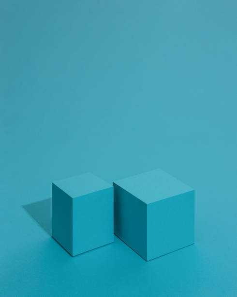 istock 3D rendering cube and box podium minimal scene studio background. Pastal colour tones. Podium for cosmetics product display with shadows and light. Blue podium for products display. 1455503972
