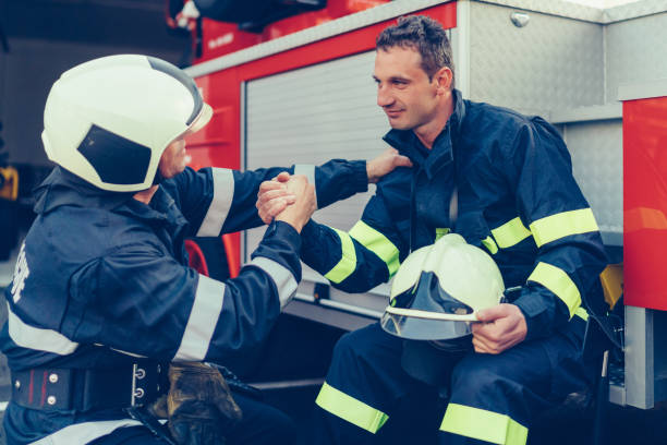 istock Firefighter supporting colleague after a hard day 1455505793