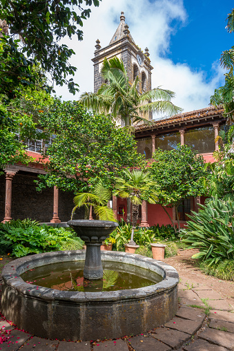 Tenerife, Canary islands - June 16, 2022: Gardens and fountain in the old convent of San Agustín in the city of La Laguna